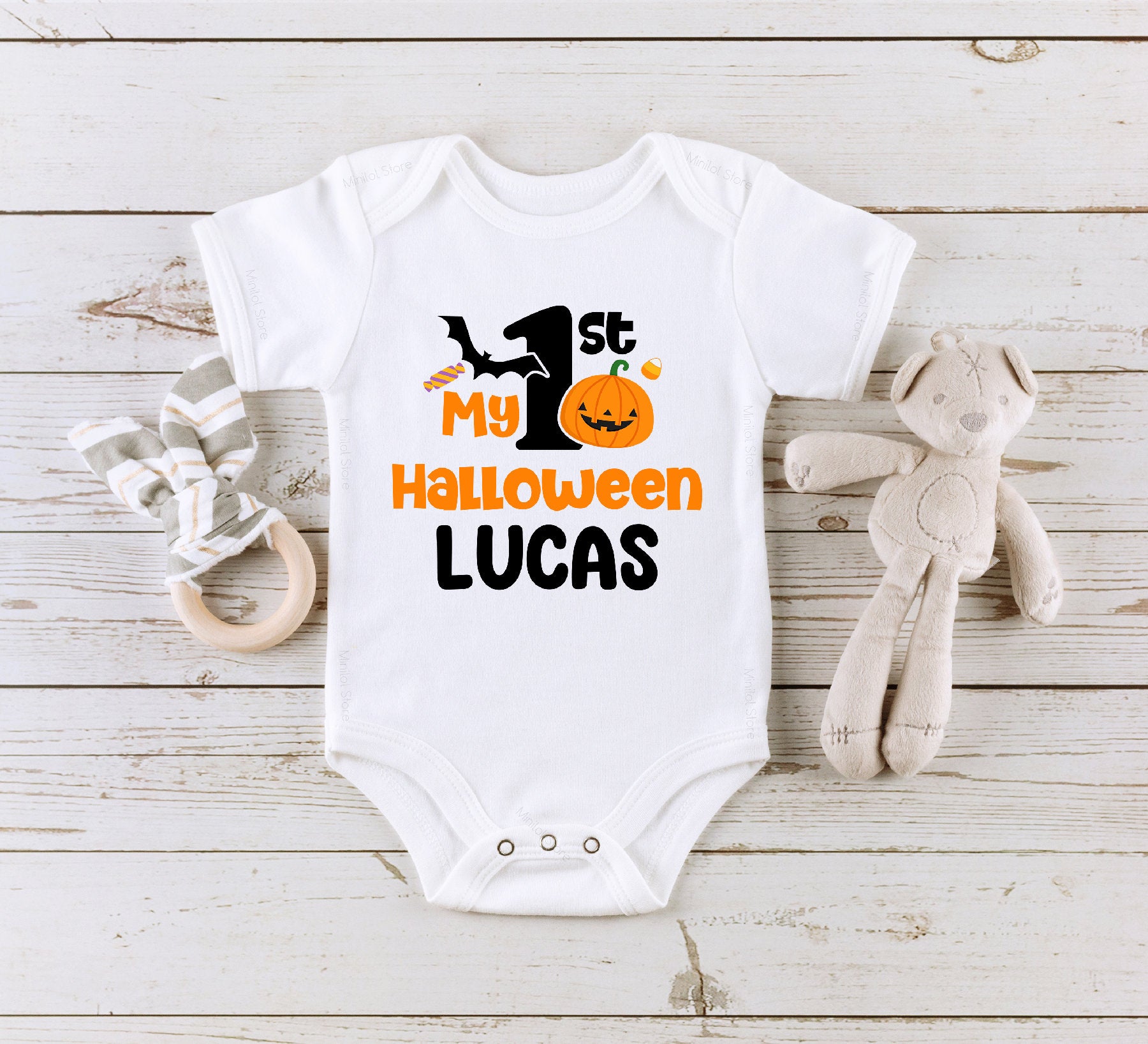 Personalized First Halloween typographic design on Baby Short Sleeve Onesie®