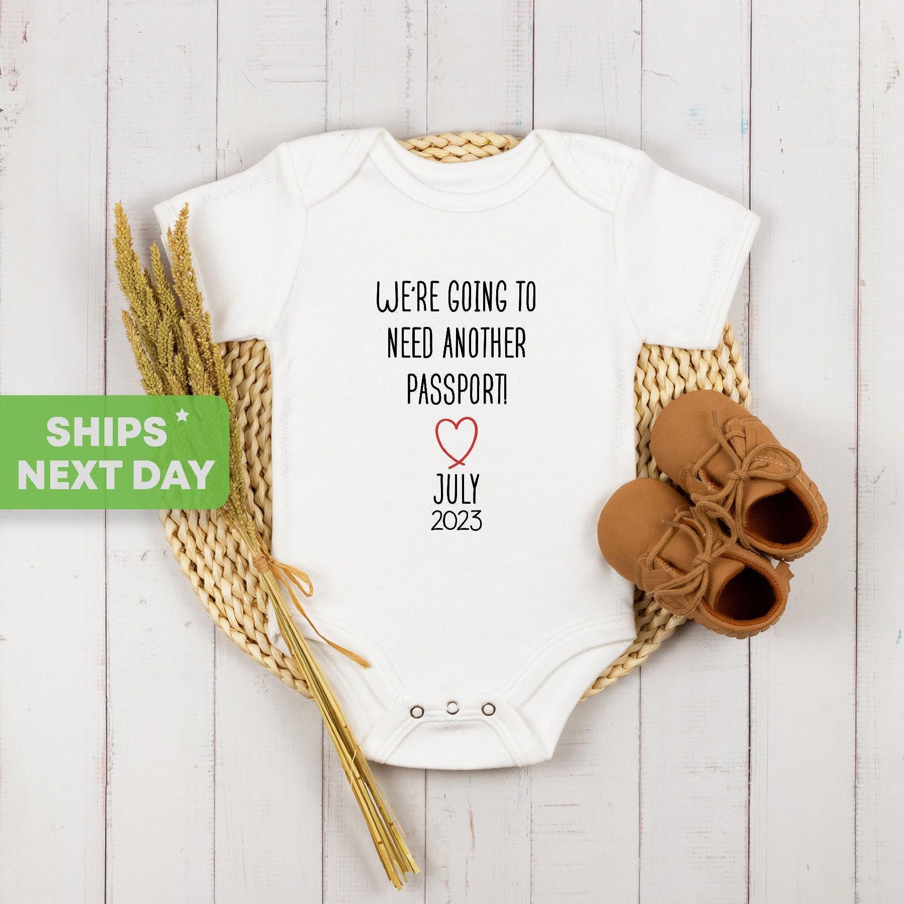 Close-up of the Pregnancy Announcement ® We Need Another Passport Travel Reveal baby announcement design