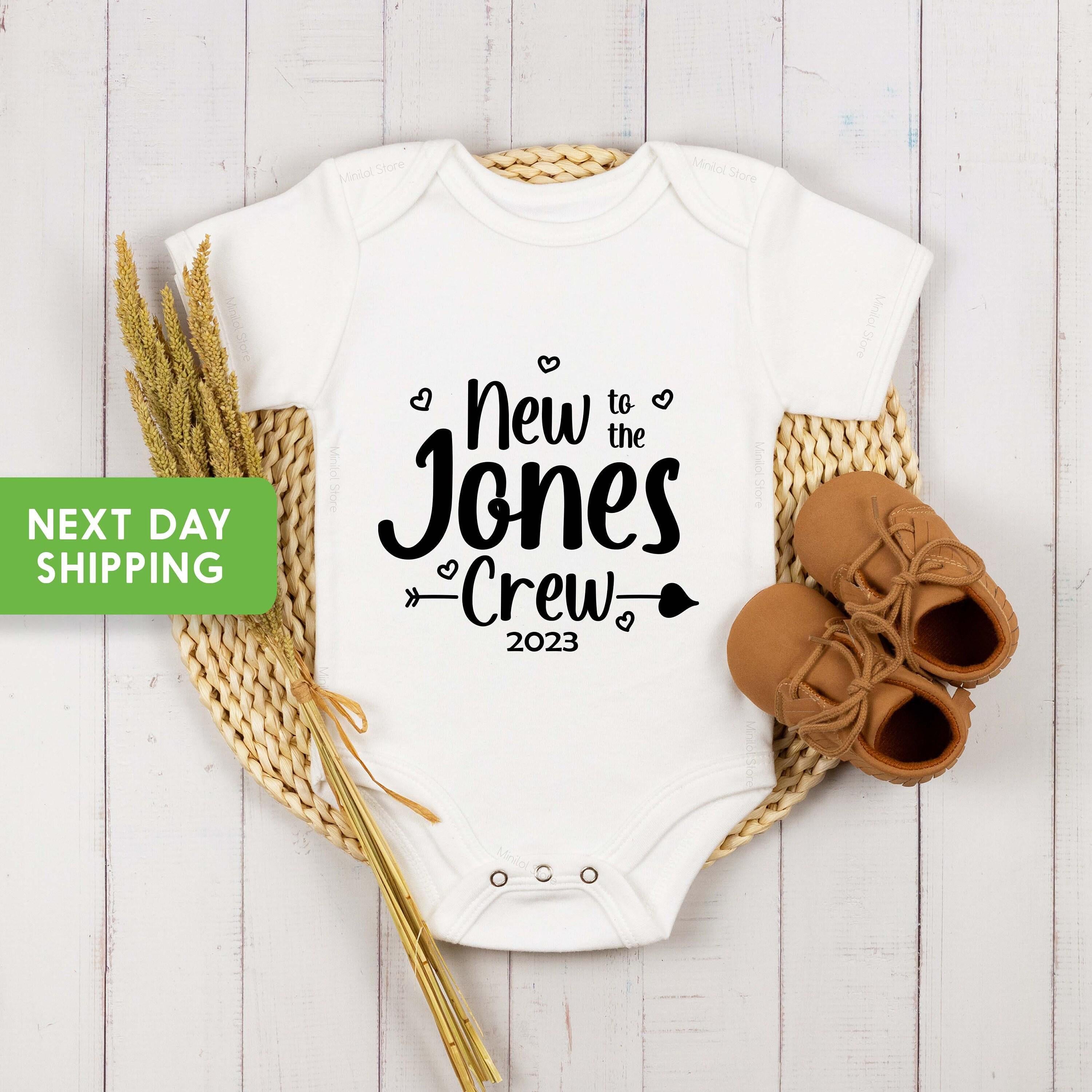 Close-up of the New to the Crew baby announcement design