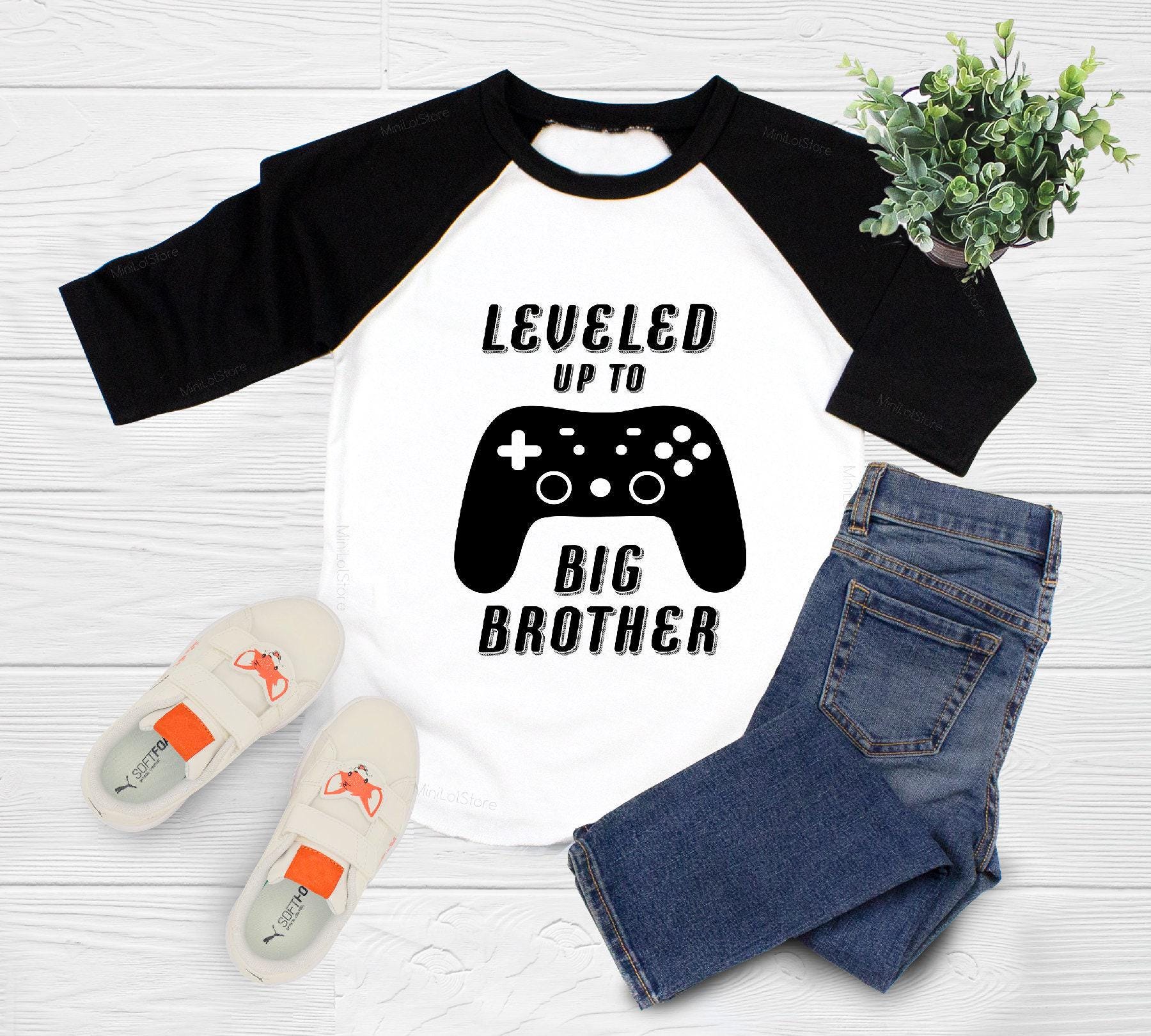 Close-up of the Leveled Up To Big Brother Gamer : Player 2 Announcement Onesies® baby announcement design