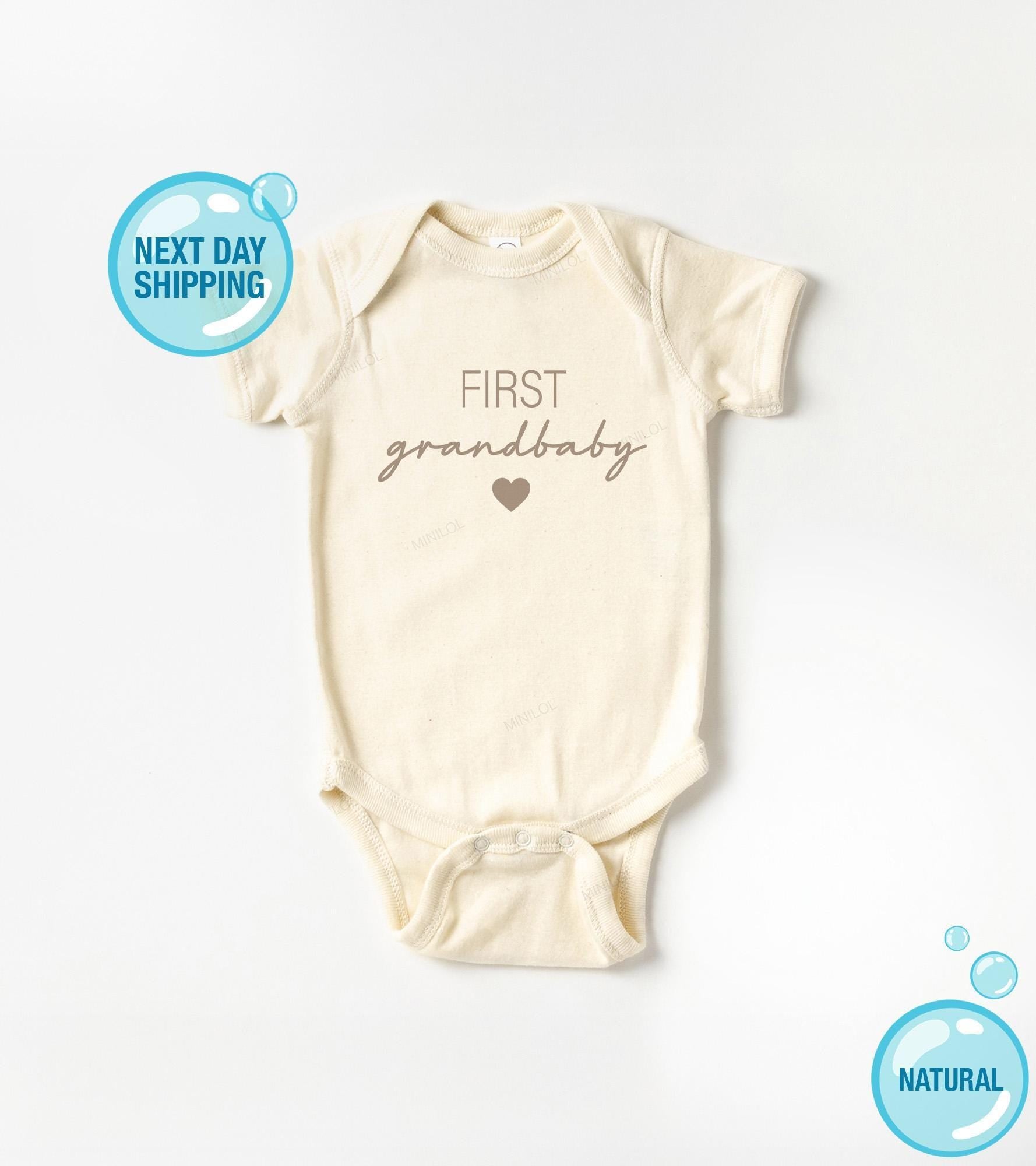 Main pregnancy announcement product mockup for First Grandbaby Grandparent Pregnancy Reveal Baby Announcement Onesie®