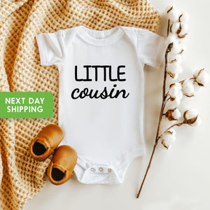 Pregnancy Announcement Cousin Reveal typographic design on Baby Short Sleeve Onesie®