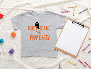 Lifestyle mockup featuring Don't Scare Me, I Poop Easily Halloween Baby Onesie®