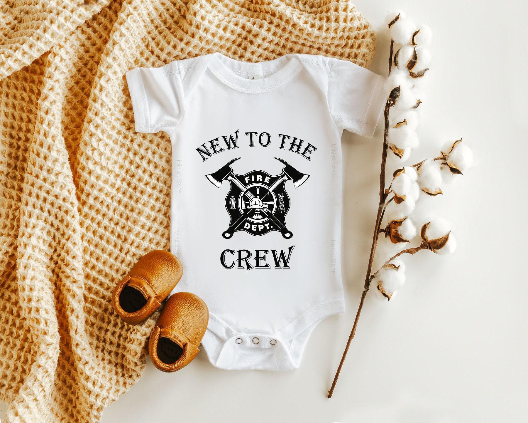Close-up of the New to the Crew baby announcement design