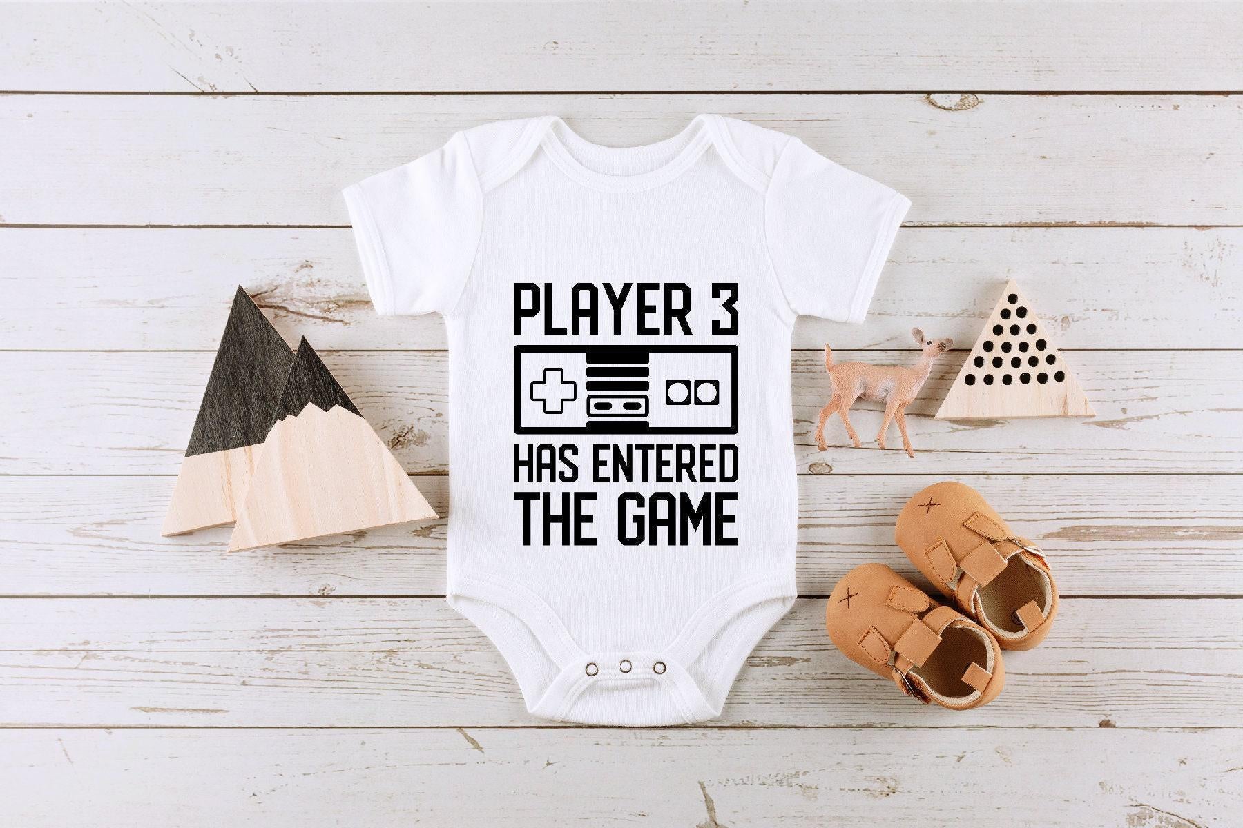 Close-up of the Player 3 Has Entered the Game baby announcement design