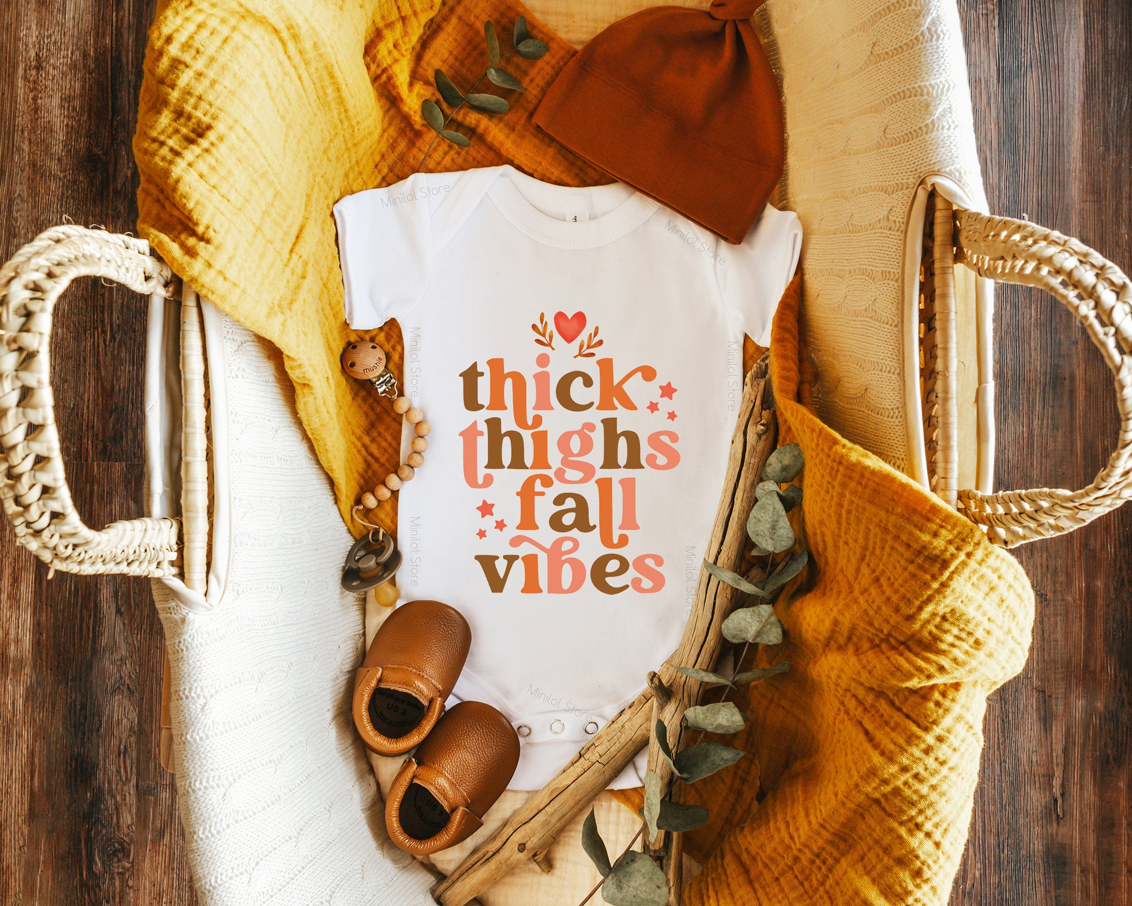 Lifestyle mockup featuring Thick Thighs & Fall Vibes Baby Onesie® – Style 2