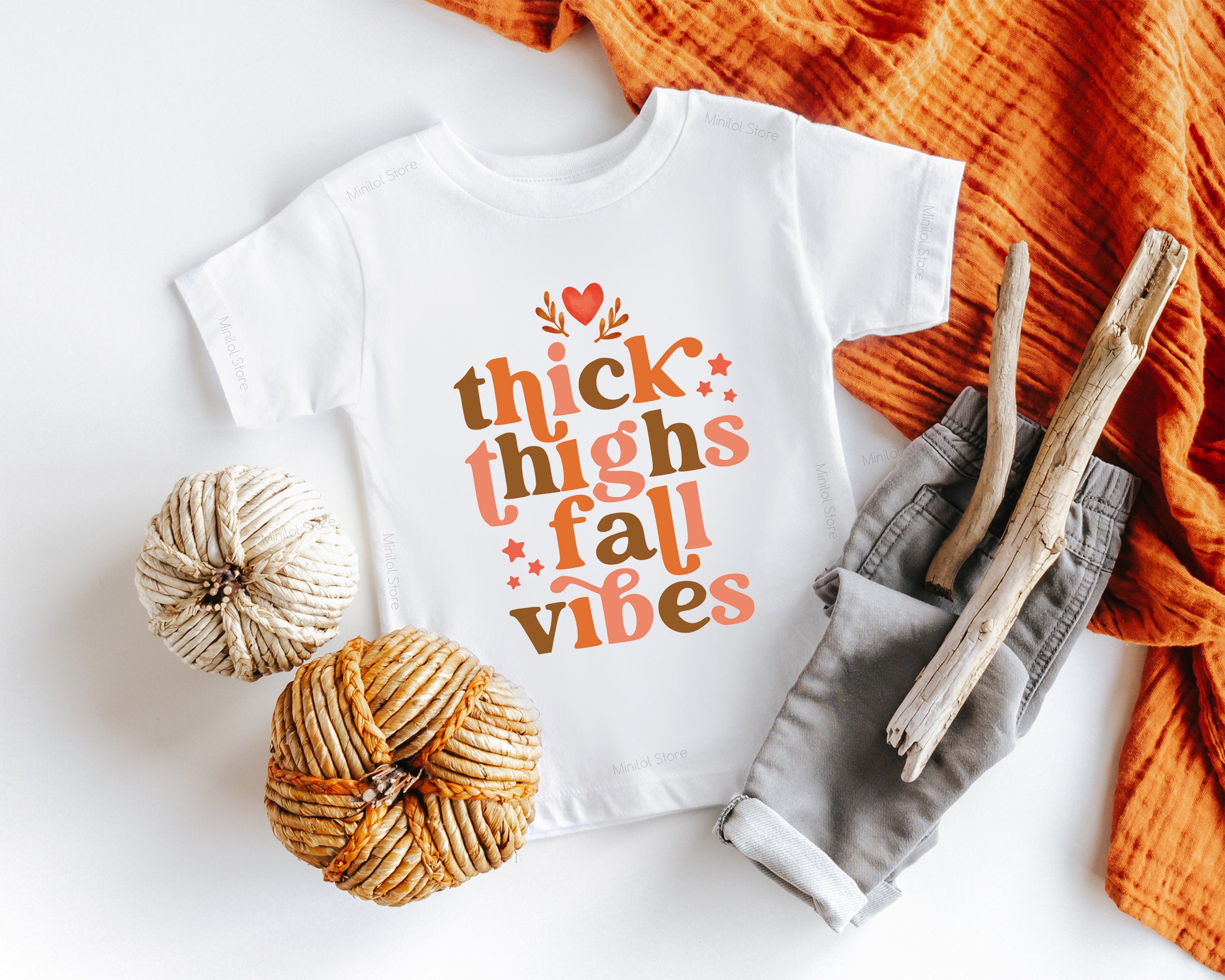 Main product mockup of Thick Thighs & Fall Vibes Baby Onesie® – Style 2