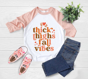Close-up of the Thick Thighs & Fall Vibes fall apparel design