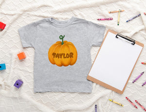 Lifestyle mockup featuring Personalized Pumpkin Fall Kids Shirt