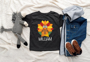 Lifestyle mockup featuring Personalized Turkey Thanksgiving Baby Onesie®