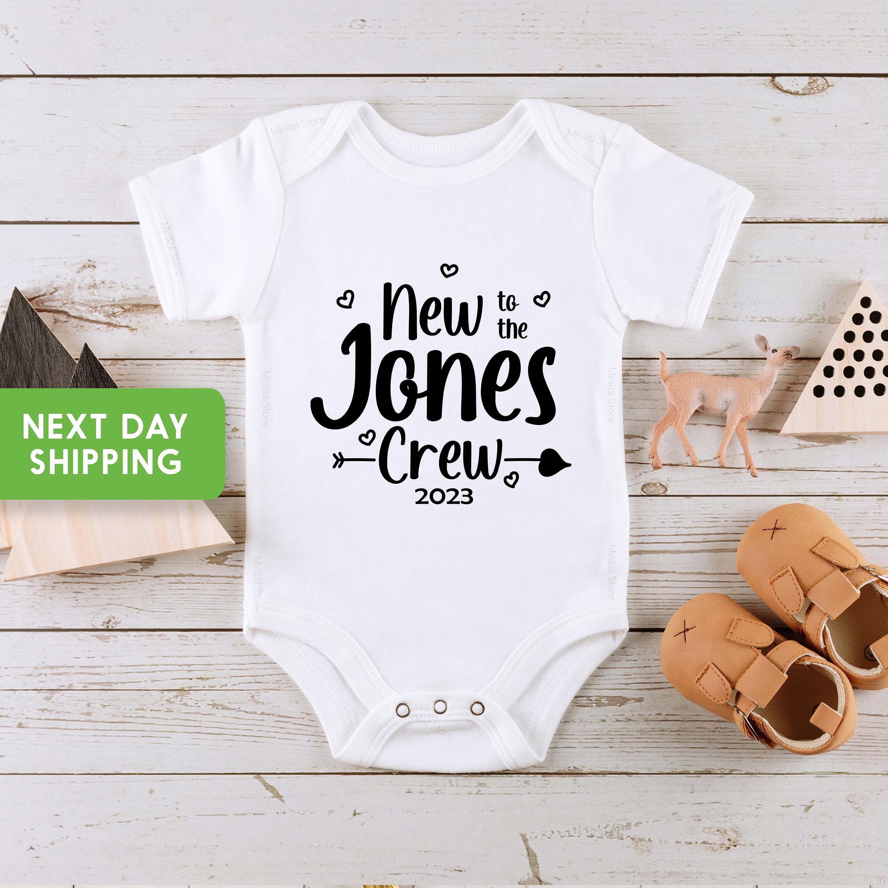 Main pregnancy announcement product mockup for New to the Crew Personalized Pregnancy Announcement Baby Announcement Onesie®