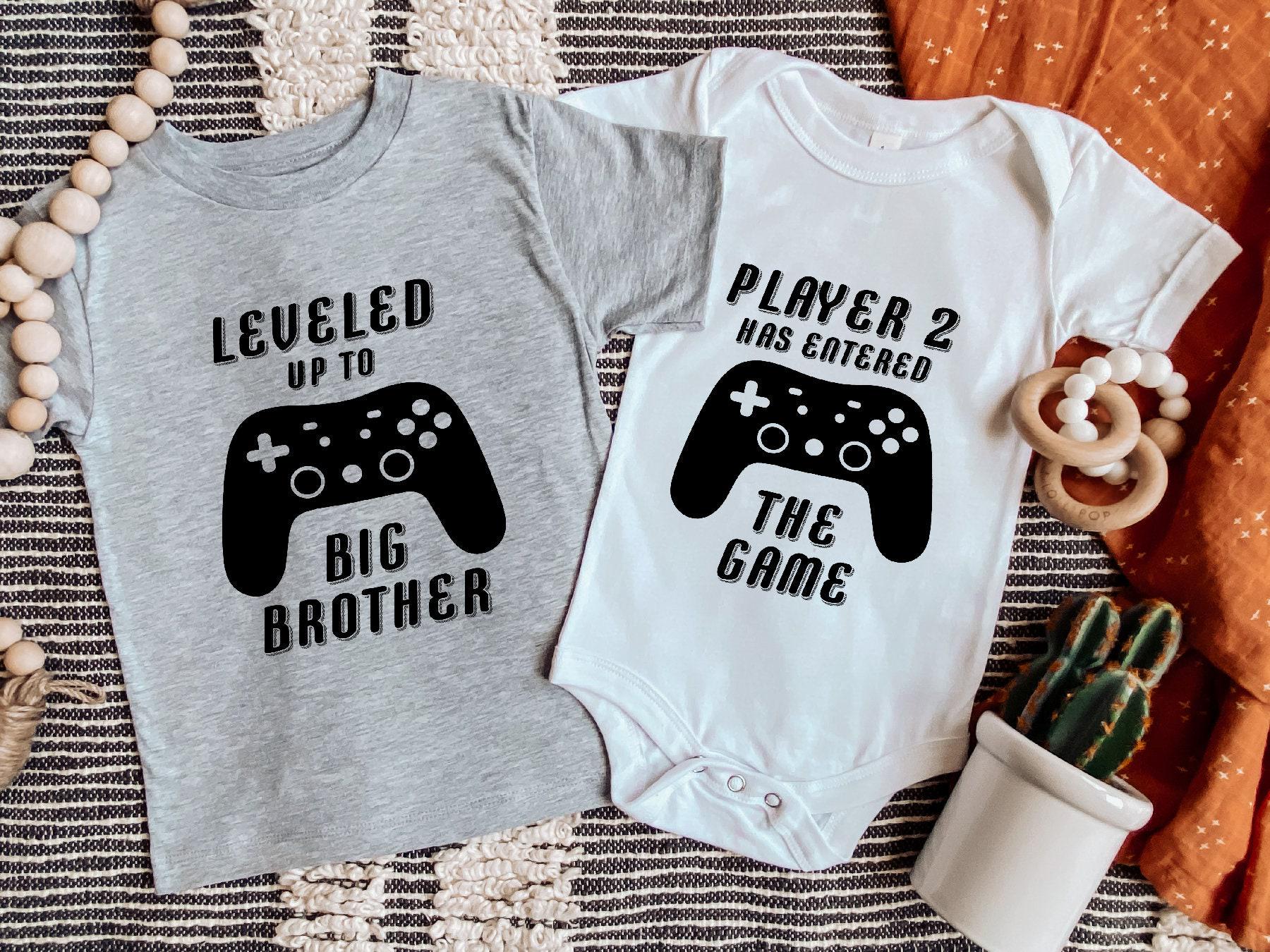 Main pregnancy announcement product mockup for Leveled Up To Big Brother Gamer : Player 2 Announcement Onesies® Pregnancy