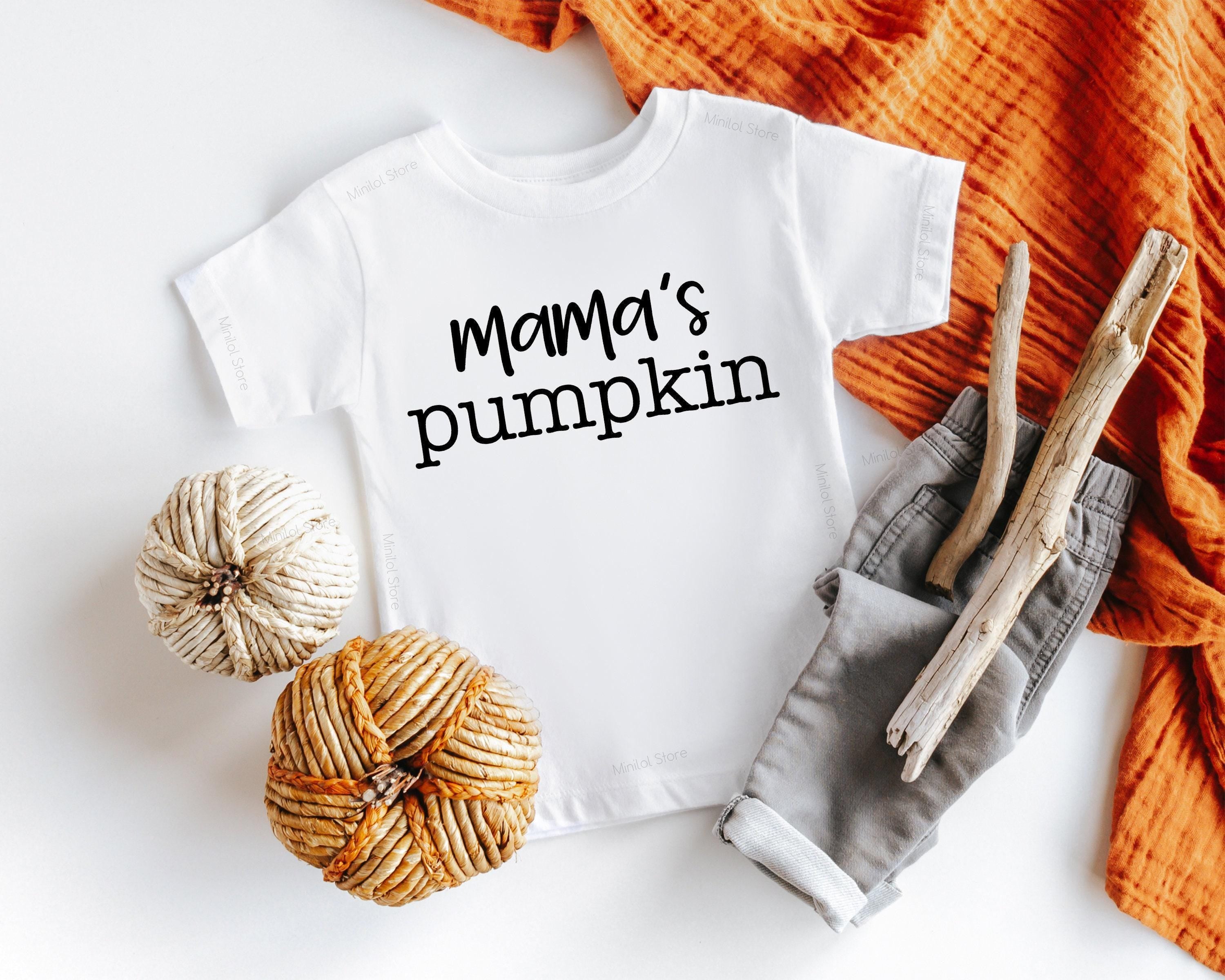 Lifestyle mockup featuring Mama's Pumpkin Fall Baby Onesie®