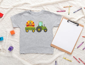 Lifestyle mockup featuring Turkey Tractor Thanksgiving Toddler Shirt