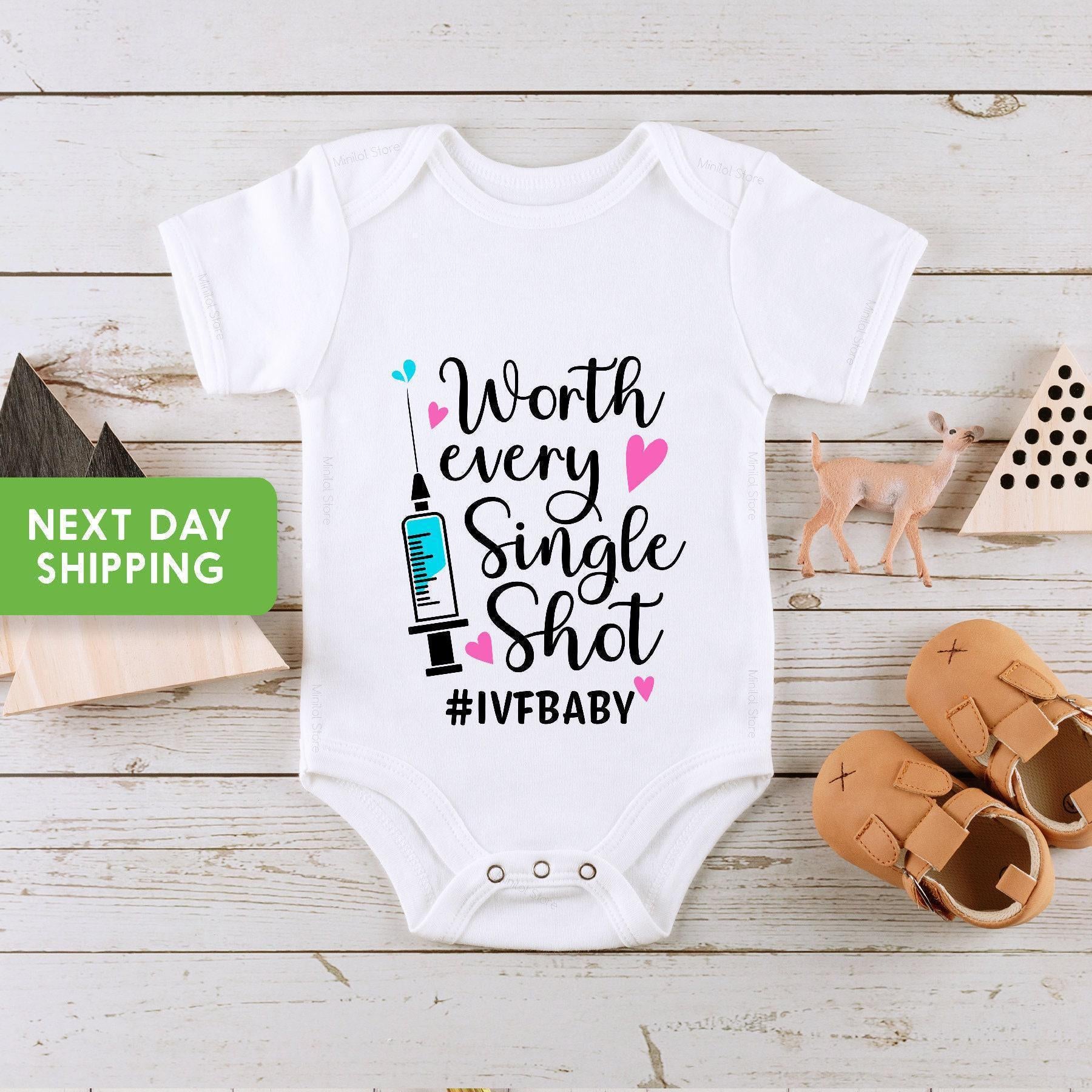 Close-up of the Worth Every Shot baby announcement design