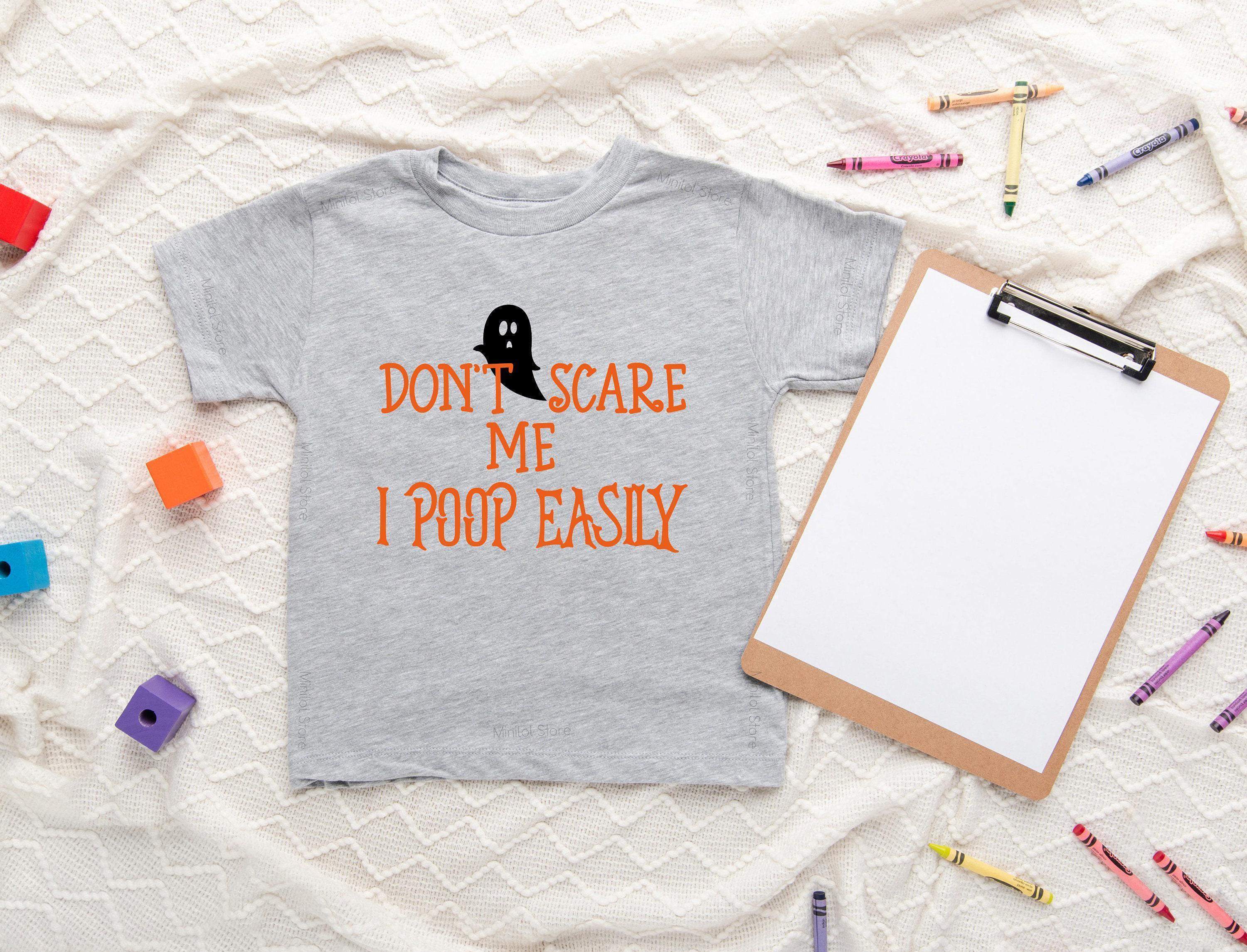 Lifestyle mockup featuring Don't Scare Me, I Poop Easily Halloween Baby Onesie®