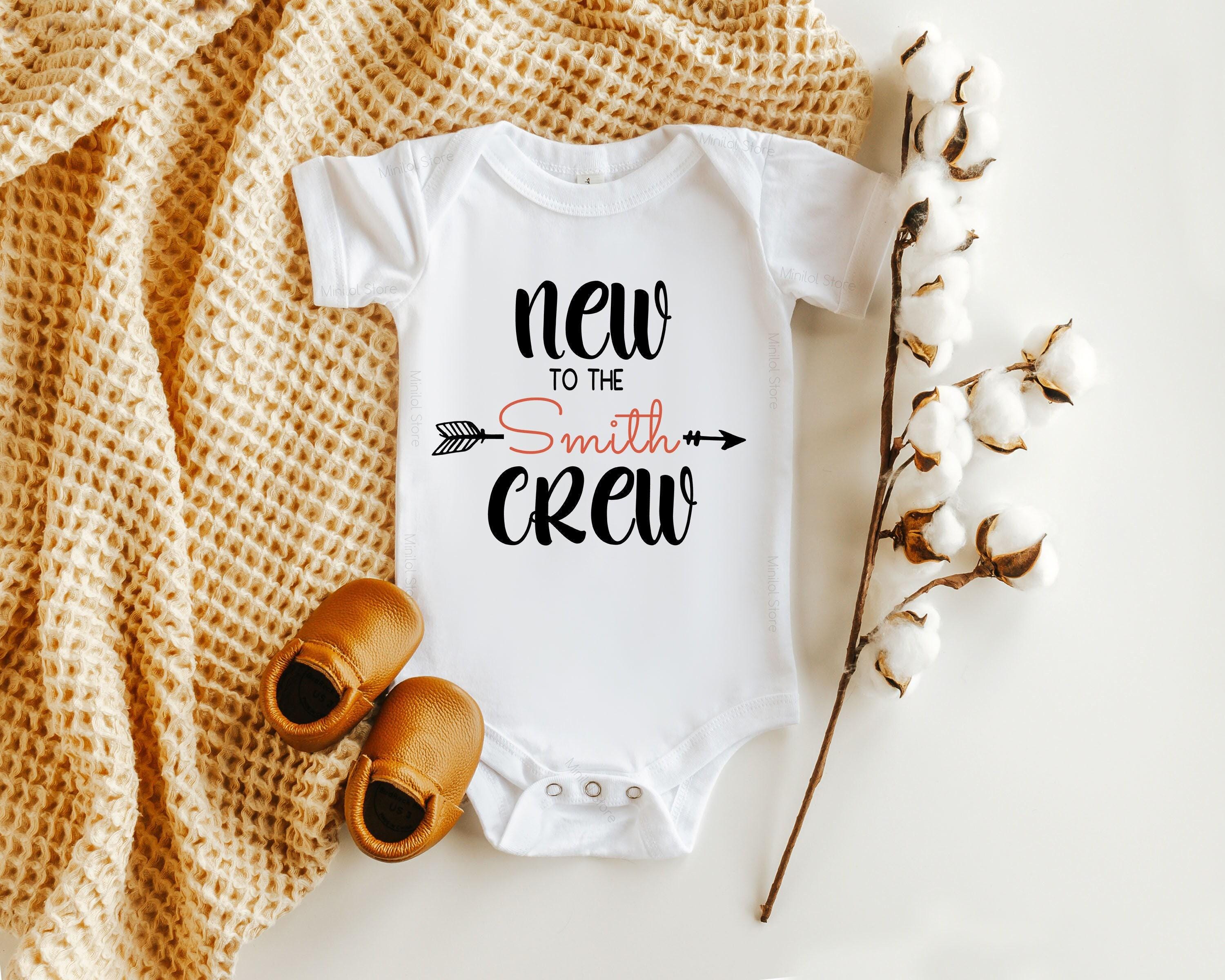 Close-up of the New to the Crew baby announcement design