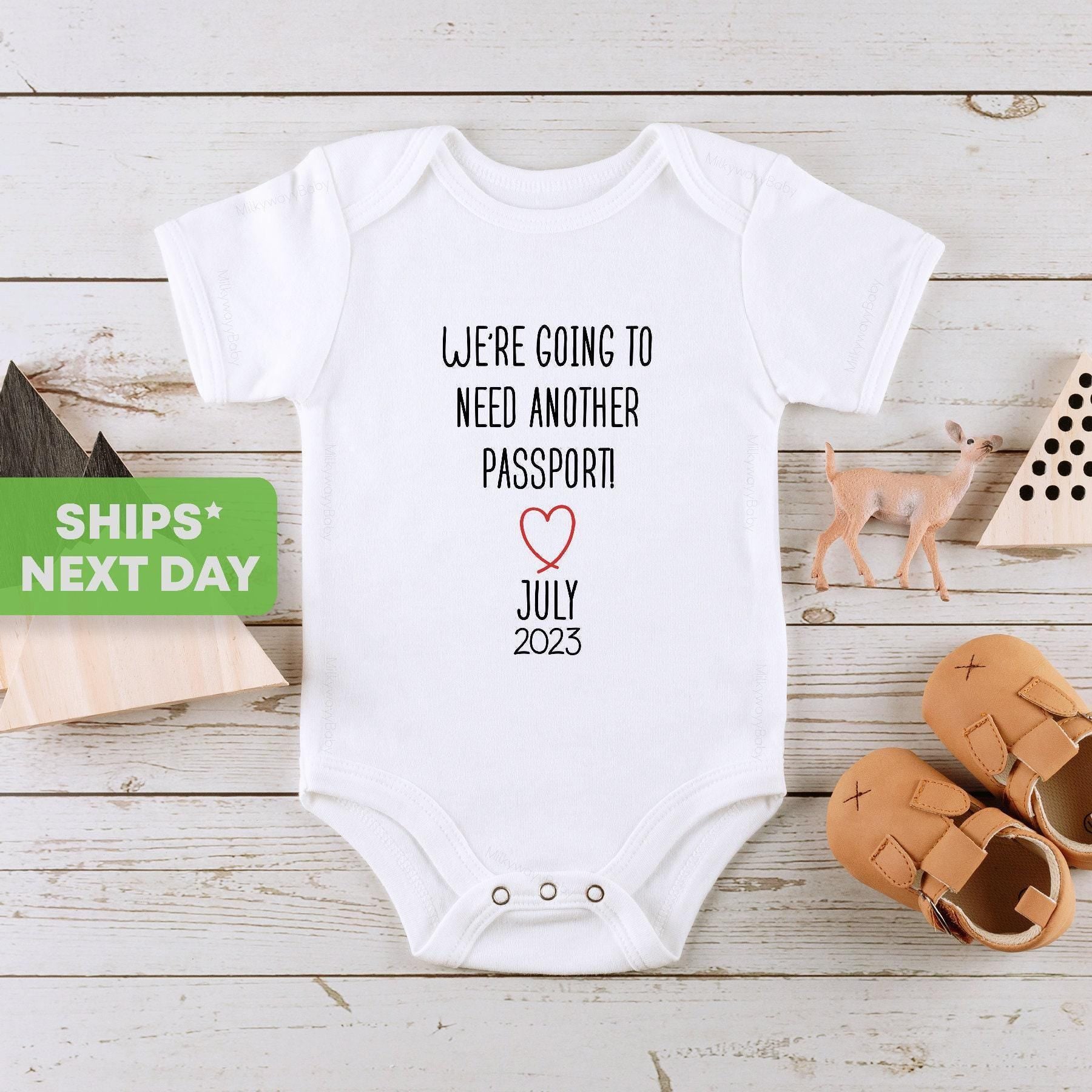 Main pregnancy announcement product mockup for Pregnancy Announcement ® We Need Another Passport Travel Reveal Pregnancy
