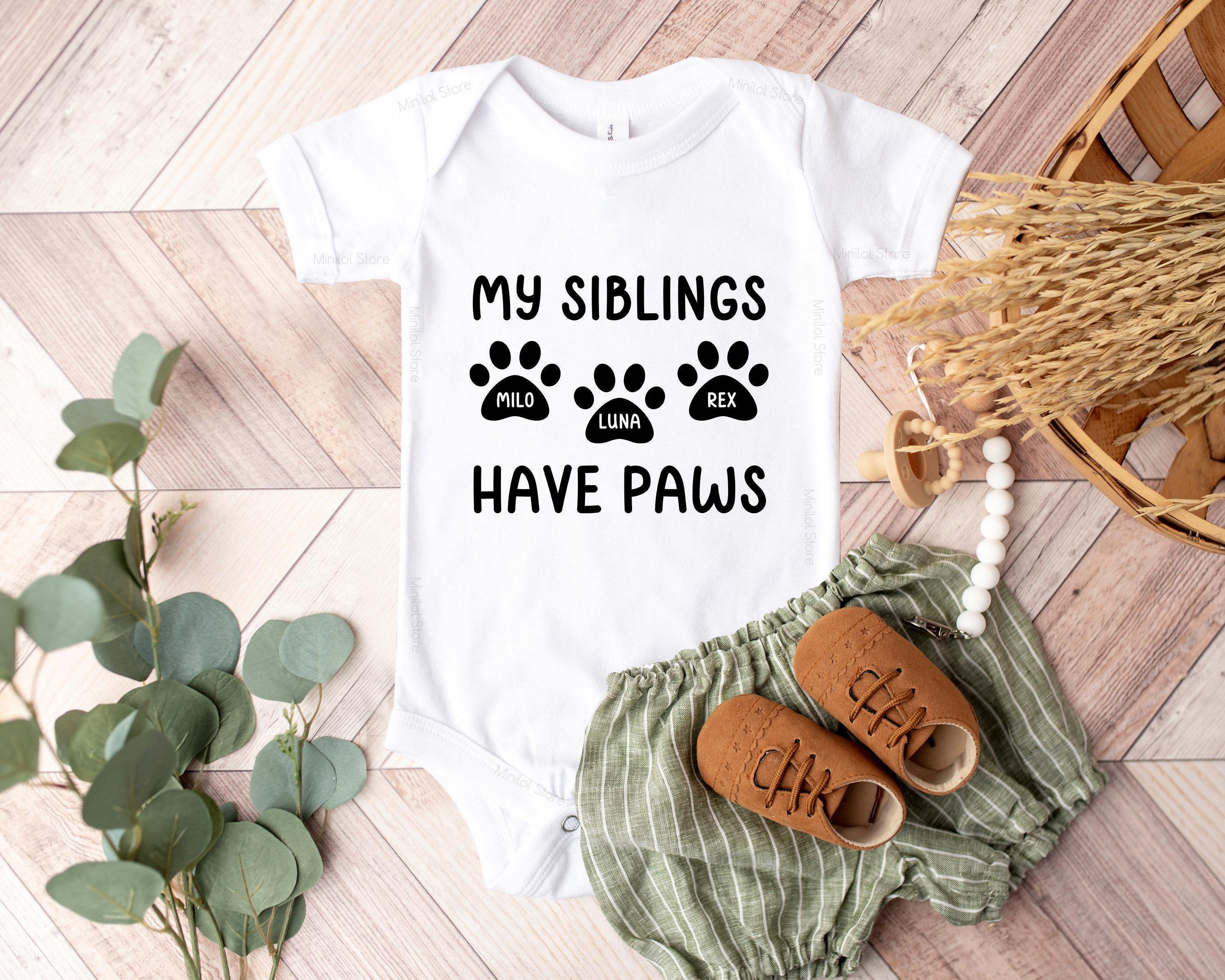 Close-up of the My Siblings Have Paws baby announcement design