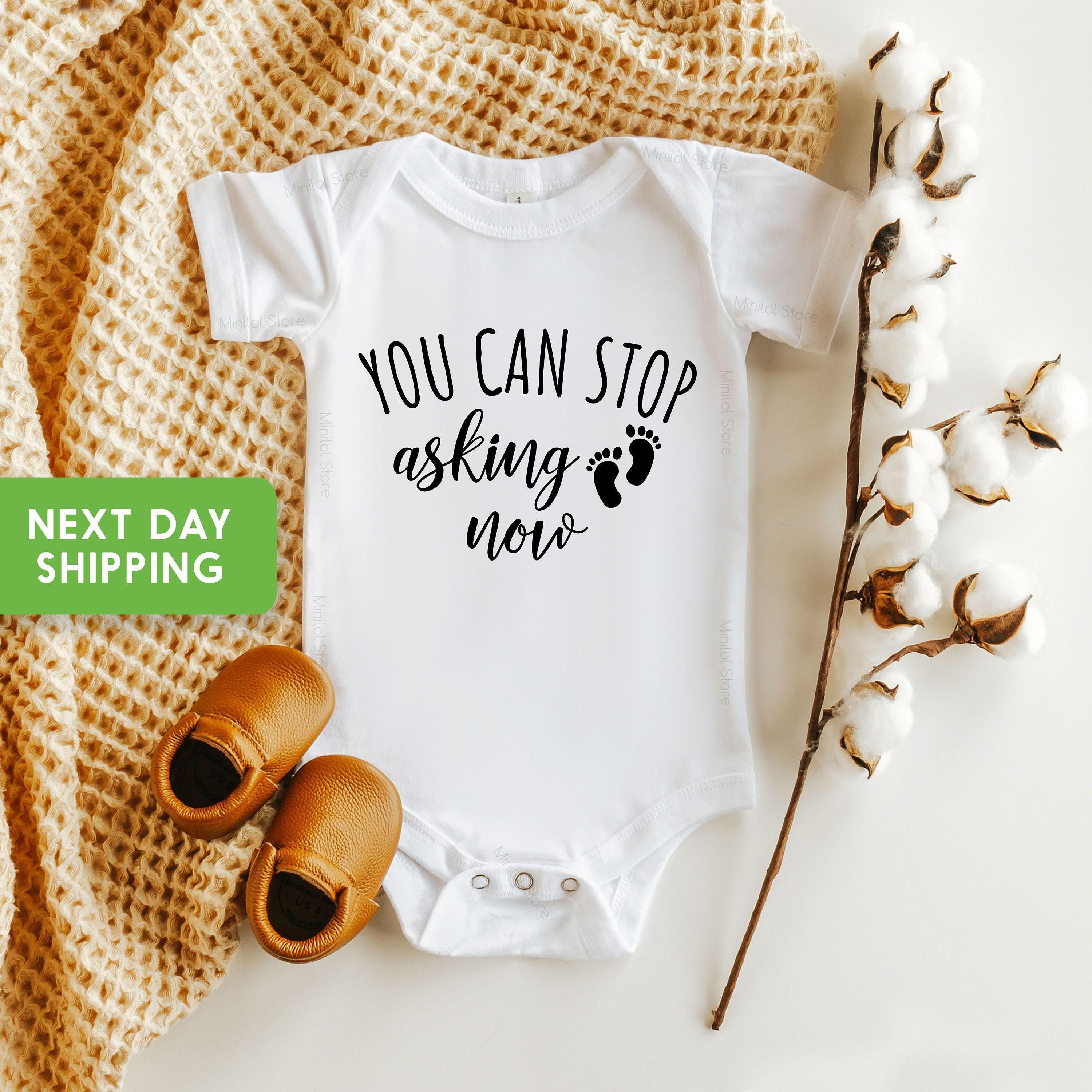 Close-up of the You Can Stop Asking Now baby announcement design