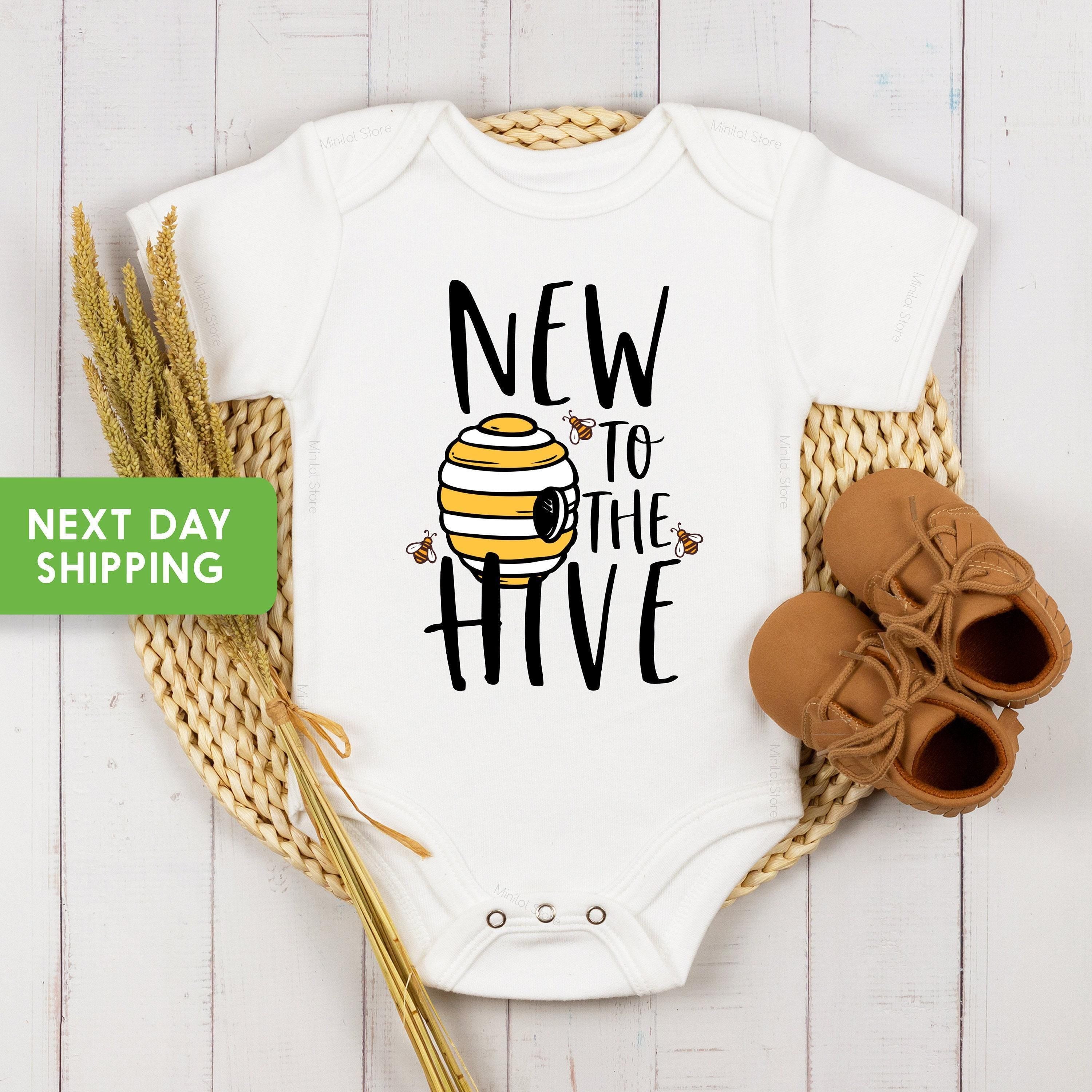 Main pregnancy announcement product mockup for New to the Hive Pregnancy Announcement Baby Announcement Onesie®