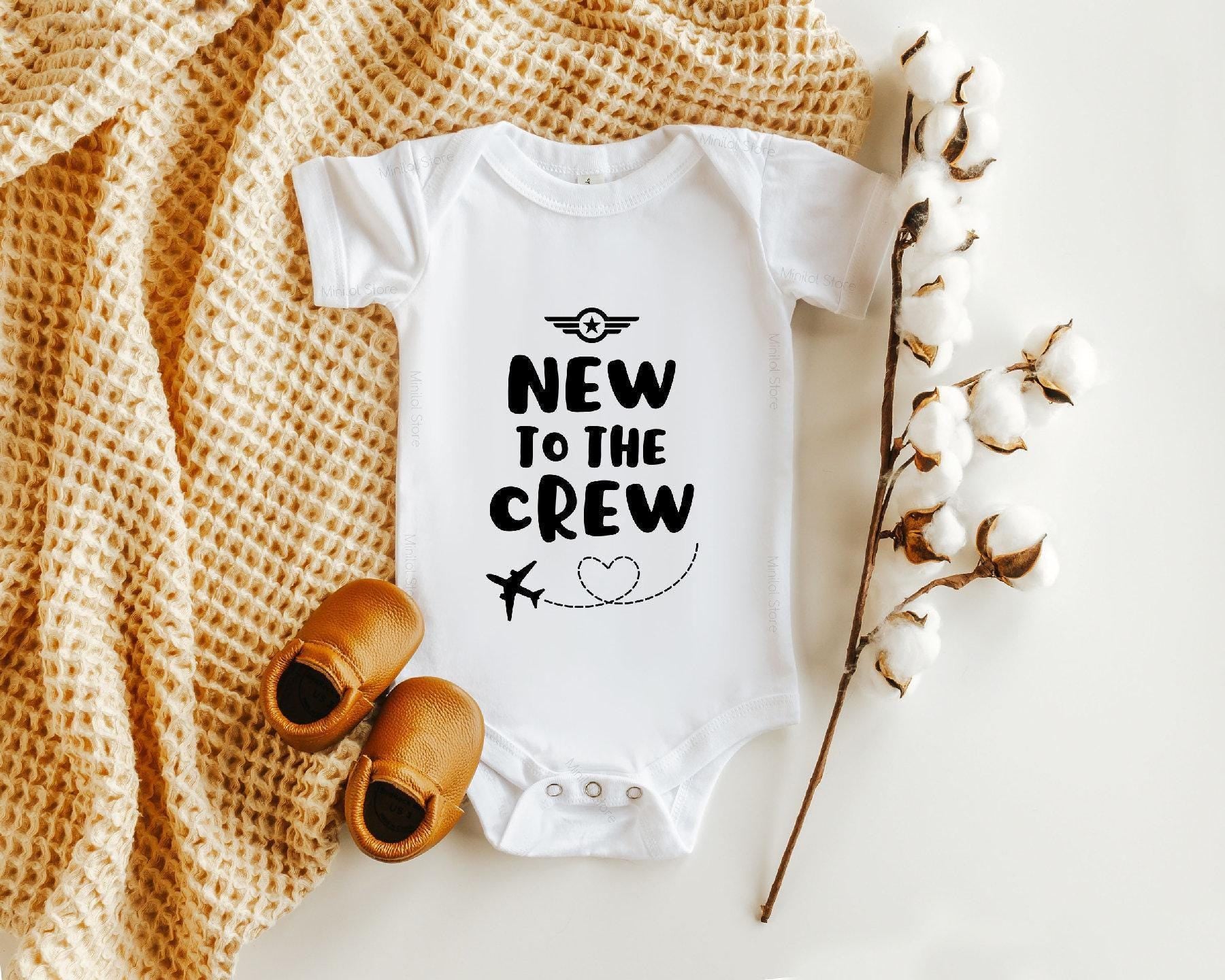 Close-up of the New to the Crew baby announcement design
