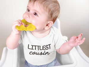 Pregnancy Announcement Cousin Reveal typographic design on Baby Short Sleeve Onesie®