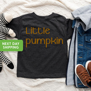 Lifestyle mockup featuring Halloween Thanksgiving Pumpkin Baby Onesie® & Kids Shirt
