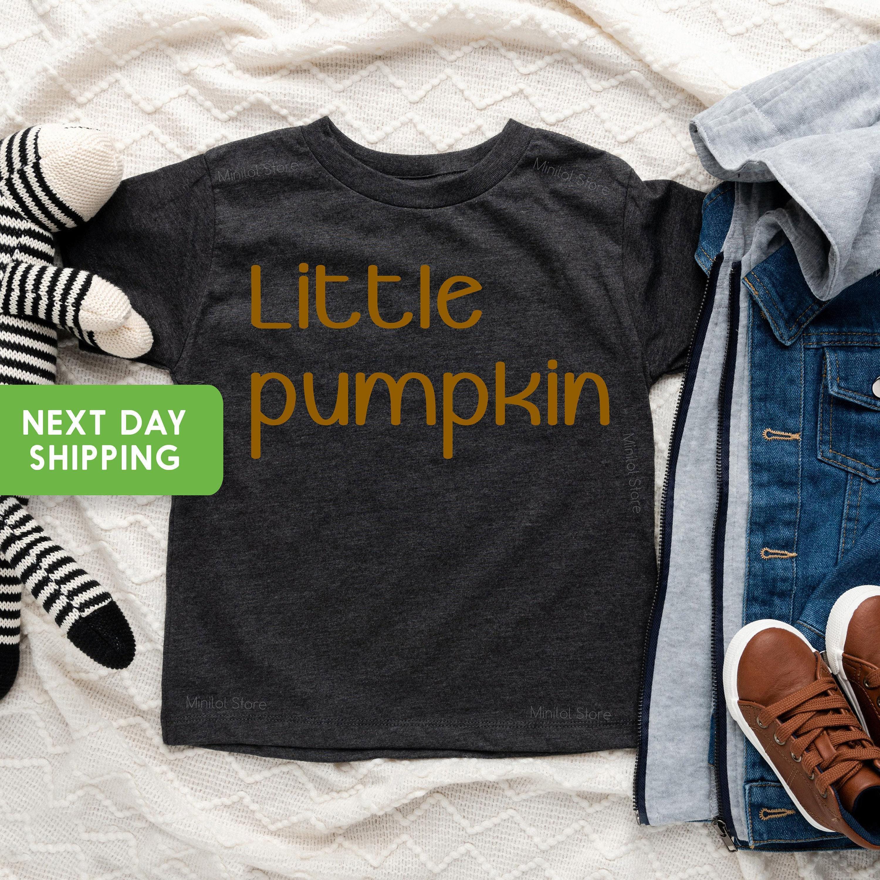 Lifestyle mockup featuring Halloween Thanksgiving Pumpkin Baby Onesie® & Kids Shirt