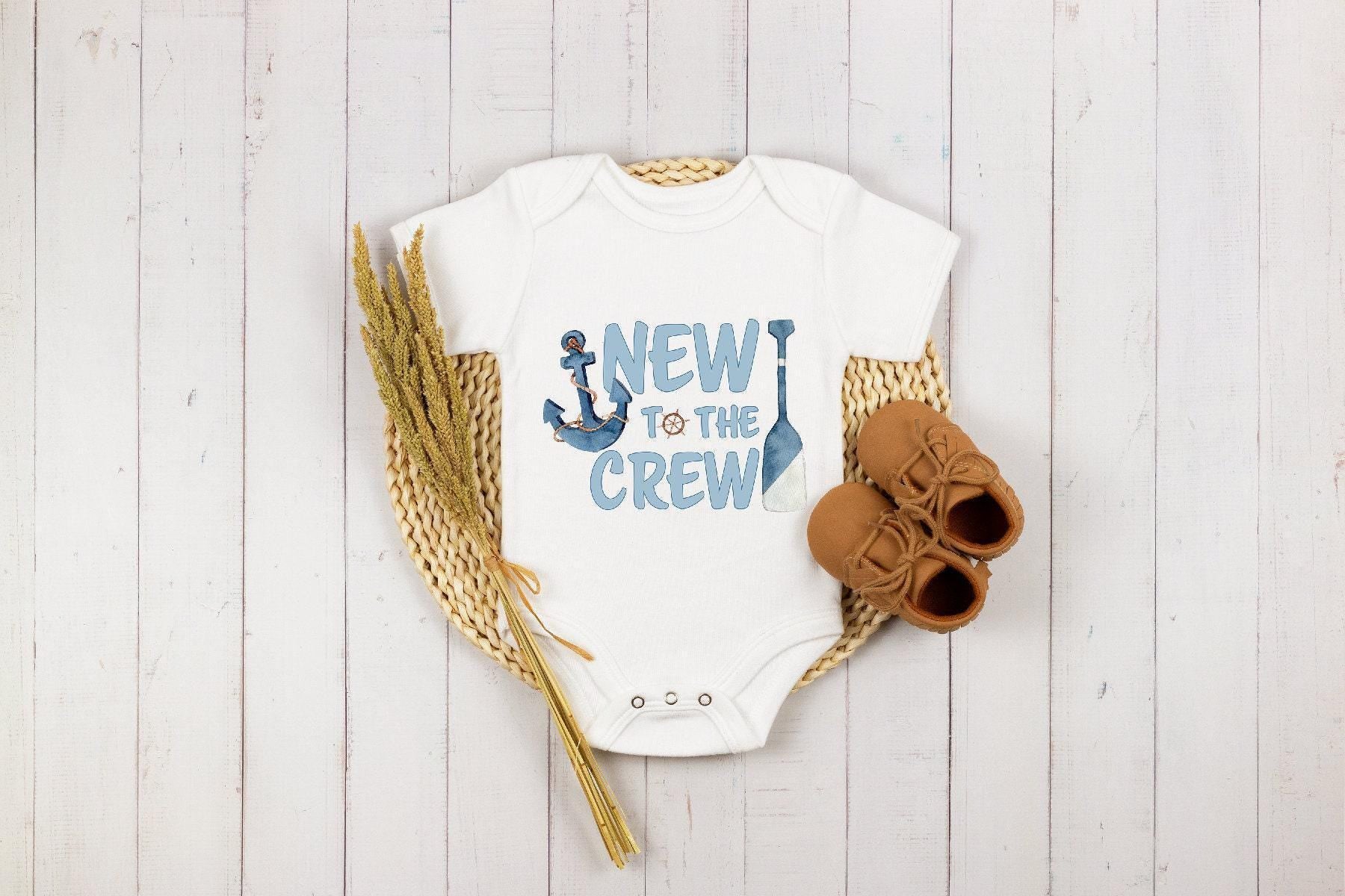 Close-up of the New to the Crew baby announcement design