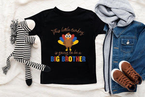 Lifestyle mockup featuring Little Turkey Big Brother Announcement Thanksgiving Kids Shirt