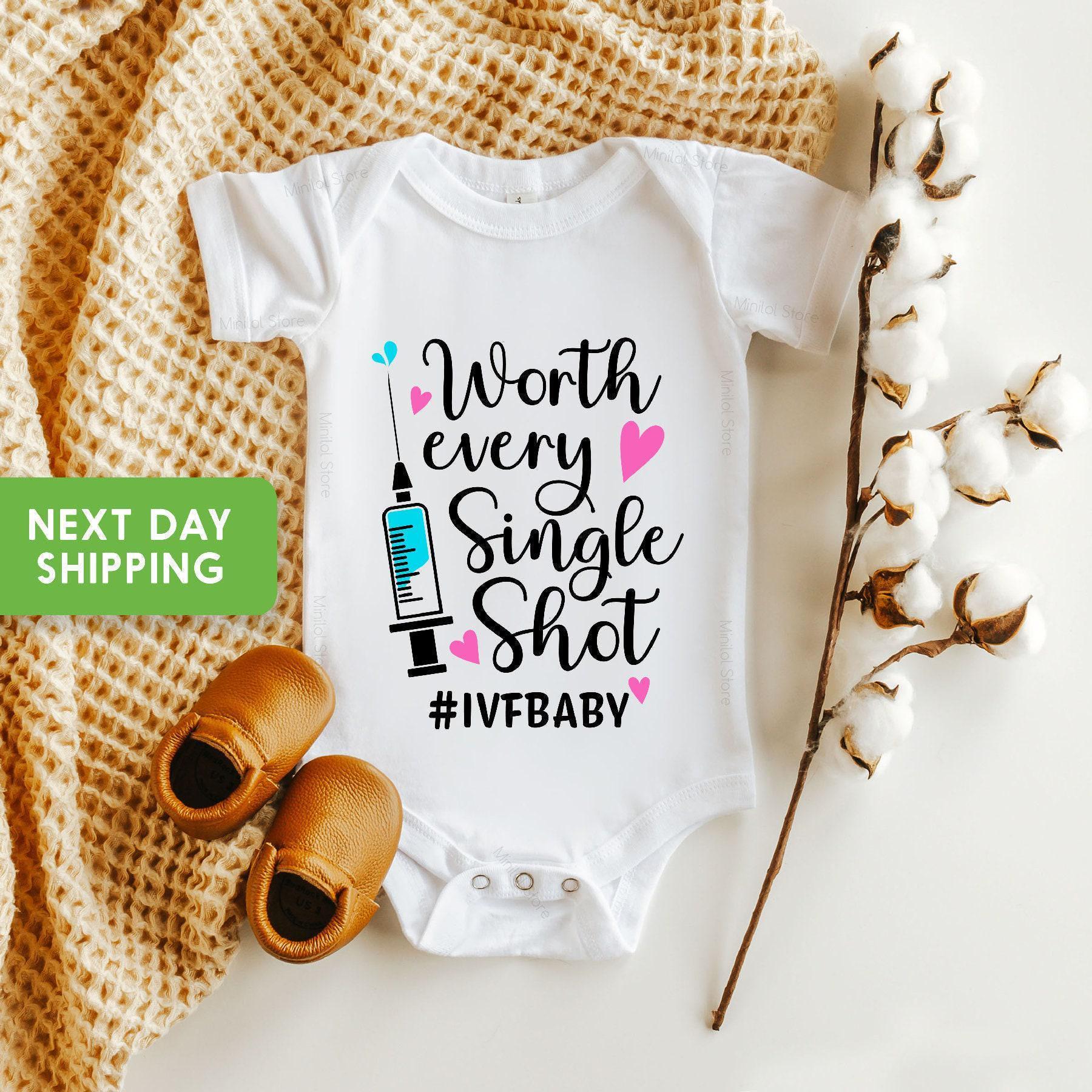 Main pregnancy announcement product mockup for Worth Every Shot IVF Baby Announcement Baby Announcement Onesie®